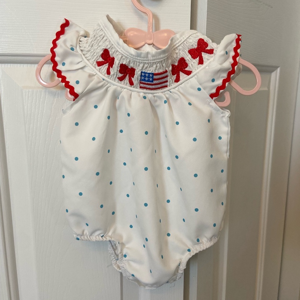 White and Blue Polka Dot Baby Romper with Red Accents